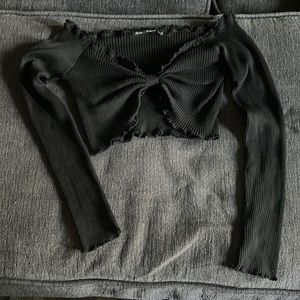 Black crop top fashionable shirt being sold.